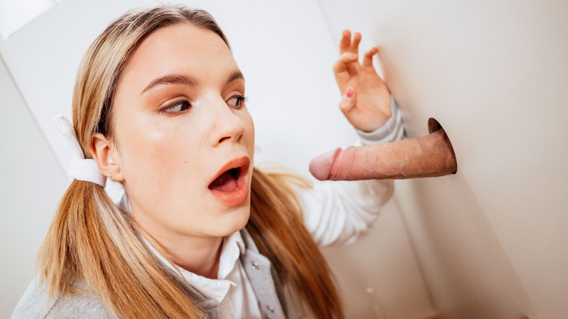 Busty college babe finds campus gloryhole